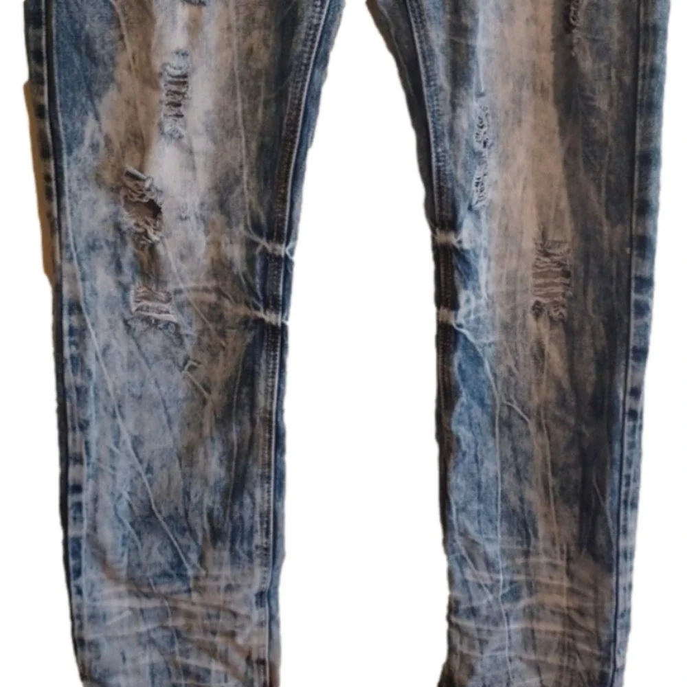 Black brand super distressed, acid wash looking jeans.Size 30x32.